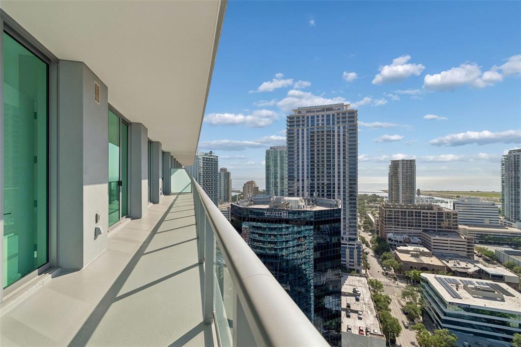 An elevated view of a city skyline featuring high-rise buildings, a marina, and the ocean — 400 CENTRAL AVENUE UNIT 2505, ST PETERSBURG, FL