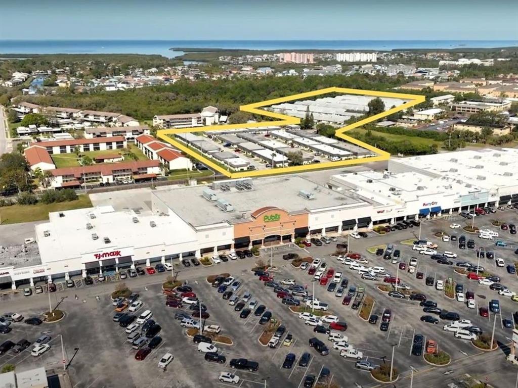 An aerial view shows a shopping center with a Publix store and a highlighted residential complex — 4954 BITNER STREET, NEW PORT RICHEY, FL