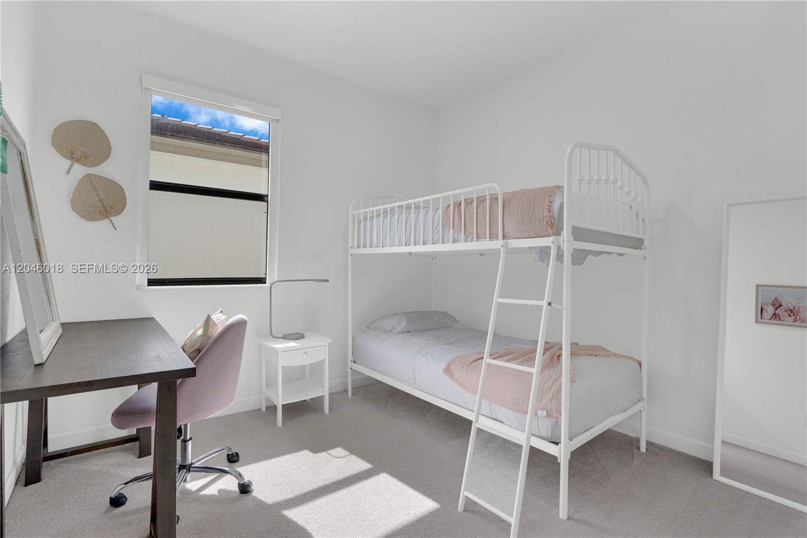 A bedroom features a white metal bunk bed, a dark desk, and a small window — 12924 SW 229th St, Miami FL 33170, MIAMI, FL