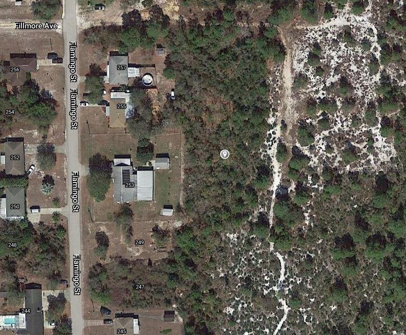 This is an aerial map view of a residential street with several houses and wooded lots — 252 SANDPIPER STREET, LAKE PLACID, FL