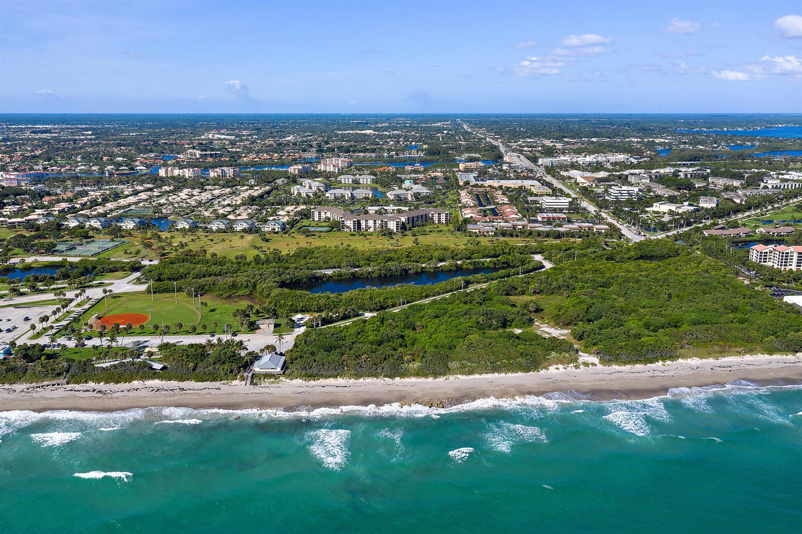 An aerial view of a coastal park with a beach, baseball field, and surrounding residential area — 353 S Us Highway 1 # A107, Jupiter FL 33477, JUPITER, FL