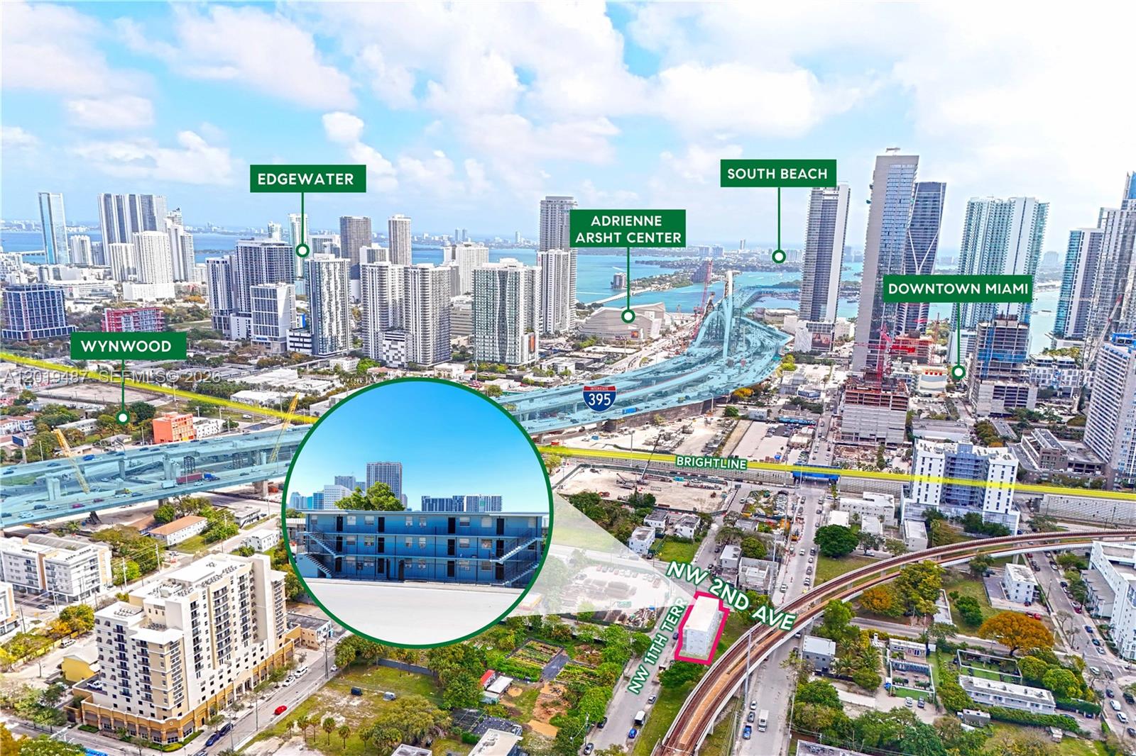 This aerial rendering shows a multi-story blue apartment building highlighted within a city landscape — 220 NW 11th Ter, Miami FL 33136, MIAMI, FL