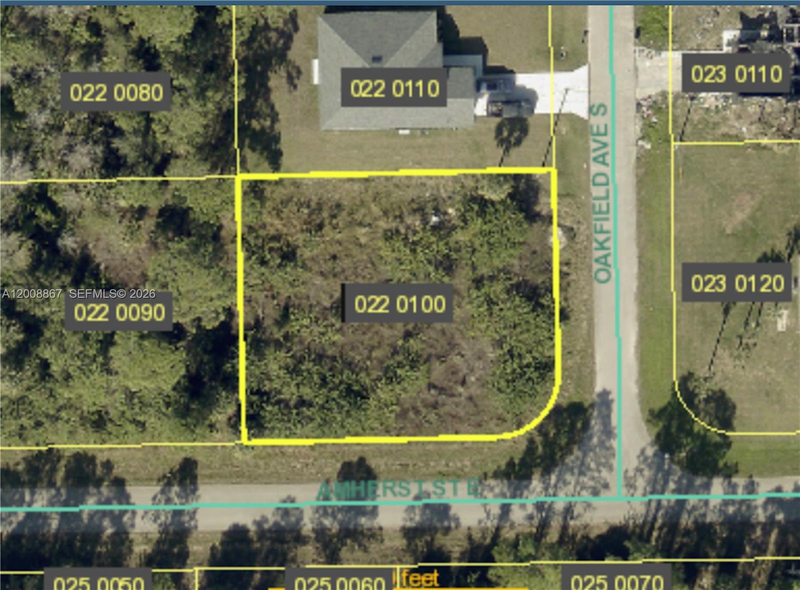 This is an aerial map showing a vacant lot outlined in yellow at a street corner — 542 OAKFIELD AVE, Lehigh Acres FL 33974, LEHIGH ACRES, FL