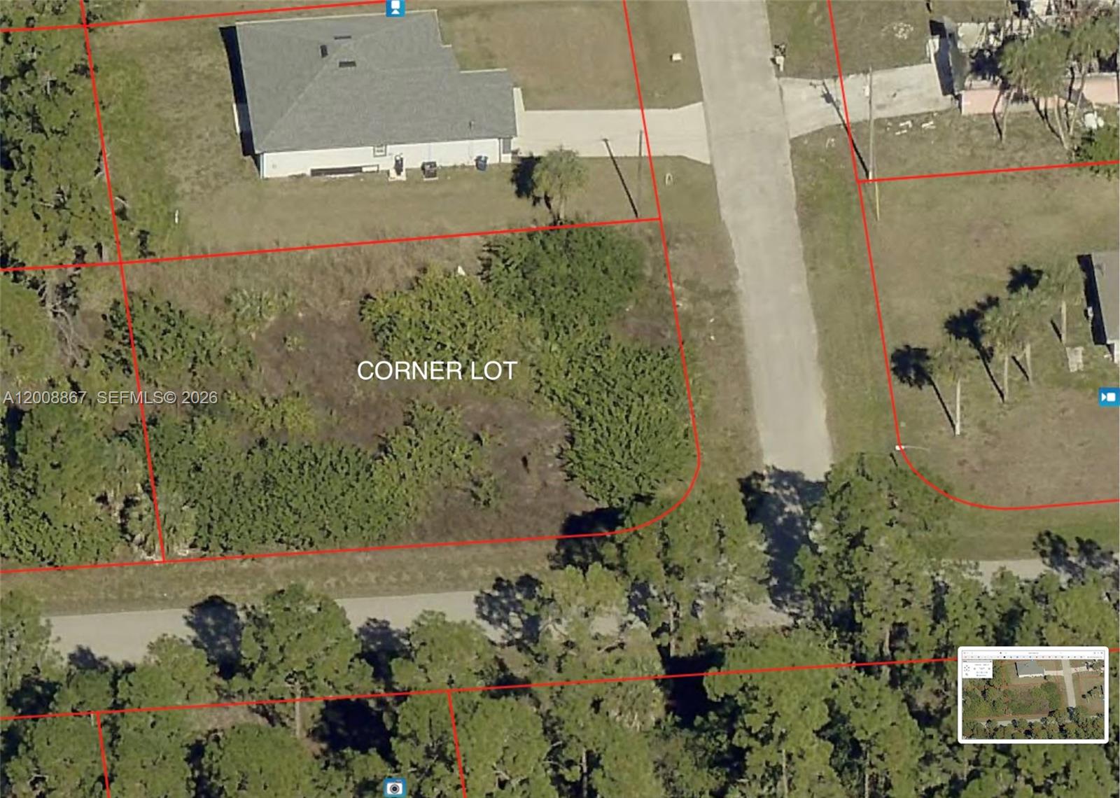 This aerial map shows a vacant corner lot outlined in red within a residential area — 542 OAKFIELD AVE, Lehigh Acres FL 33974, LEHIGH ACRES, FL
