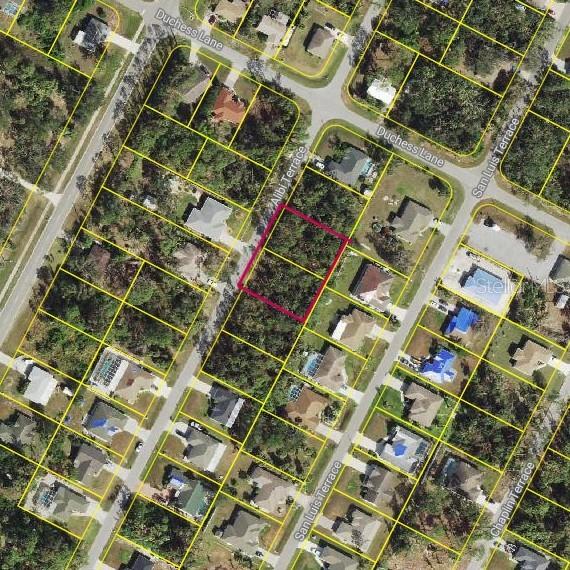 This is an aerial map showing a vacant lot outlined in pink within a residential neighborhood — ALIBI TERRACE, NORTH PORT, FL