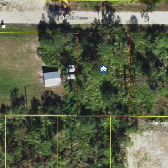 This is an aerial map view of a wooded, rectangular residential lot — 23507 MACBETH COURT, PUNTA GORDA, FL