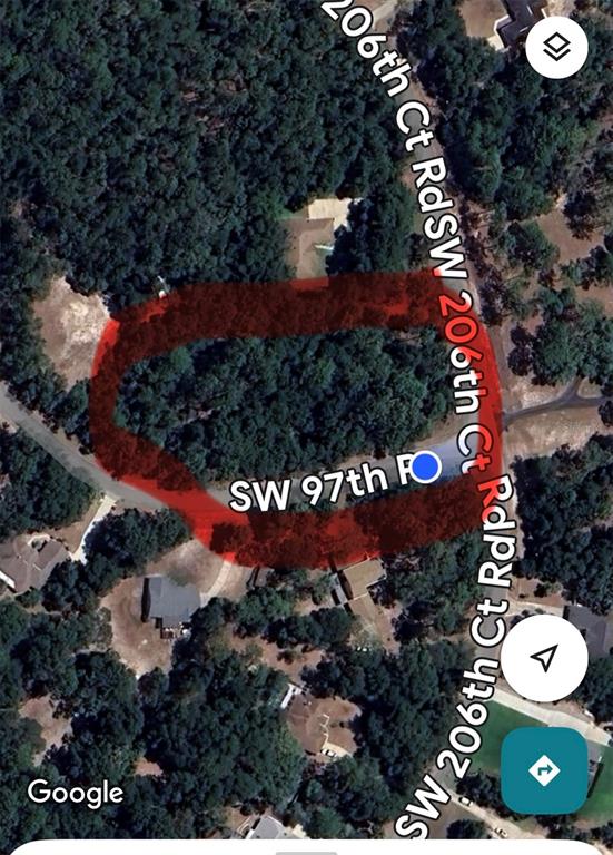 This is a satellite map view showing a wooded lot highlighted in red — Lot 33 SW 97 PLACE, DUNNELLON, FL