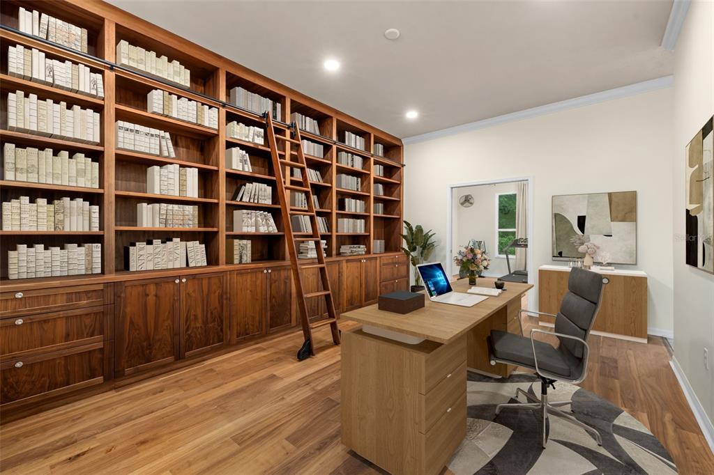 A home office features a large wooden bookshelf with a rolling ladder and a desk — 2501 NW 91ST DRIVE, GAINESVILLE, FL