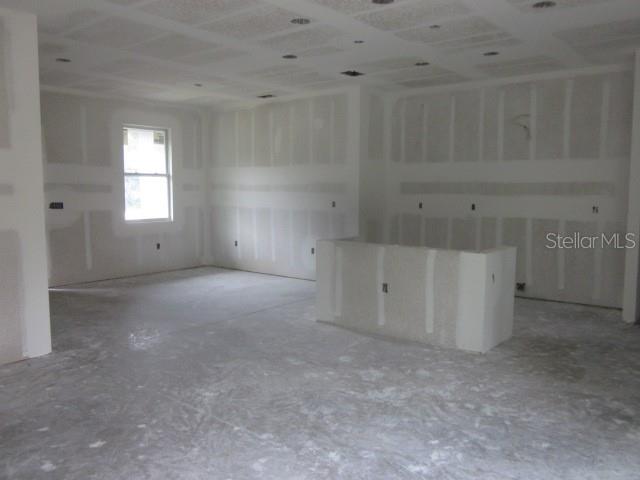 An unfinished room with drywall, a central island base, and a single window — 15456 PIEDMONT AVENUE, PORT CHARLOTTE, FL
