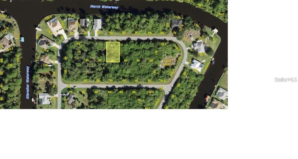 This is an aerial map showing a vacant residential lot highlighted in yellow — 1089 MARCH DRIVE, PORT CHARLOTTE, FL