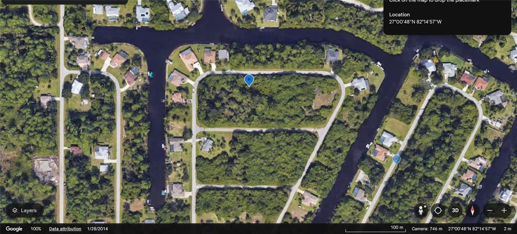 This is a satellite map view of a residential area with vacant lots and canals — 1089 MARCH DRIVE, PORT CHARLOTTE, FL