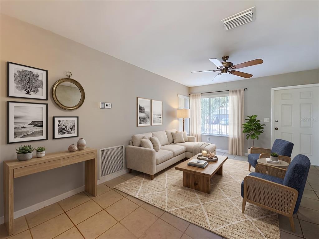 A living room features a beige sectional sofa, two blue armchairs, and a console table — 4804 BATCHELOR AVENUE, NORTH PORT, FL