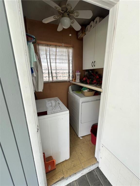 A small laundry room features a washer, dryer, ceiling fan, and white wall cabinets — 1950 Cortez Boulevard, Fort Pierce FL 34982, FORT PIERCE, FL