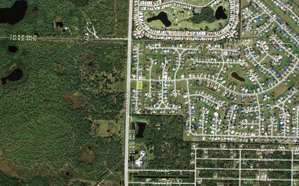 Aerial map view showing a highlighted vacant lot within a residential neighborhood — 7400 S SEAGRAPE ROAD, PUNTA GORDA, FL