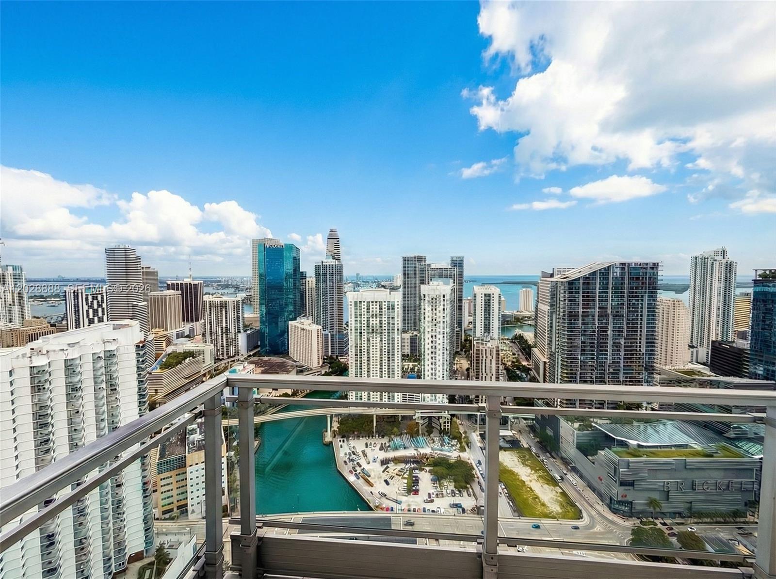 A high-angle view from a balcony overlooking the Miami skyline and the Miami River — 92 SW 3rd St, Miami FL 33130, MIAMI, FL