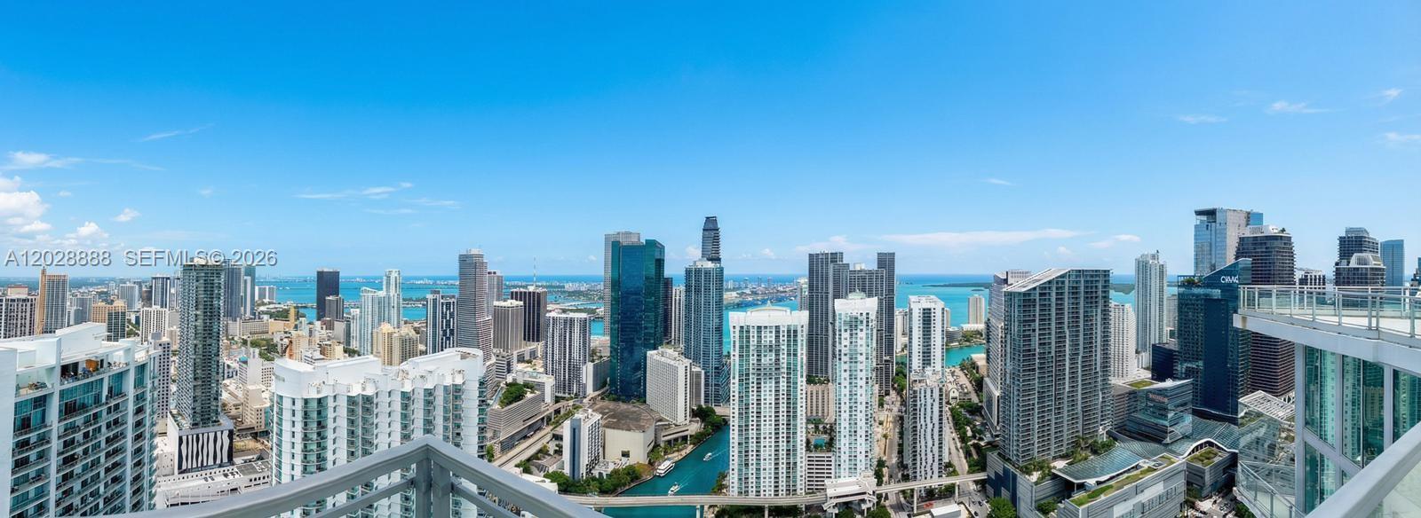 A high-angle view of the Miami skyline featuring numerous skyscrapers, a canal, and the ocean — 92 SW 3rd St, Miami FL 33130, MIAMI, FL