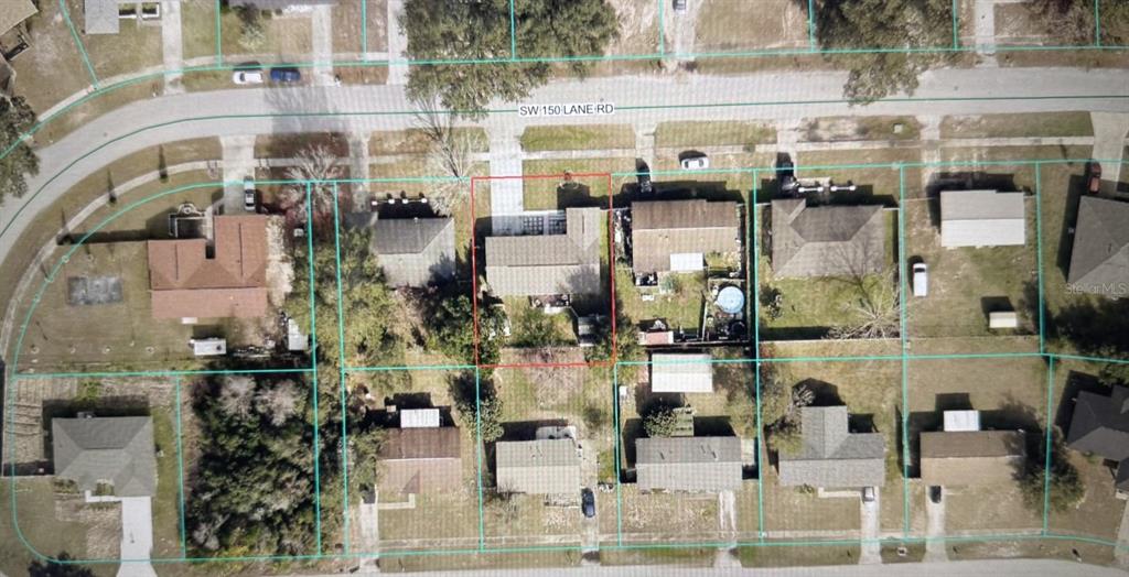 This is an aerial view of a residential property outlined in red on a street — 3610 SW 150TH LANE ROAD, OCALA, FL