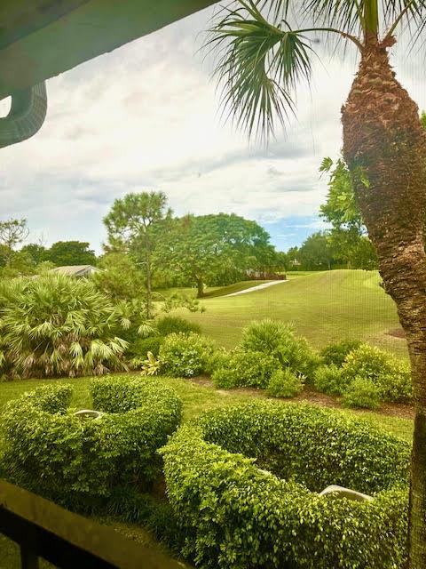 A view from a screened-in porch overlooking a lush green lawn and a golf course — 15814 Loch Maree Lane # 3305, Delray Beach FL 33446, DELRAY BEACH, FL