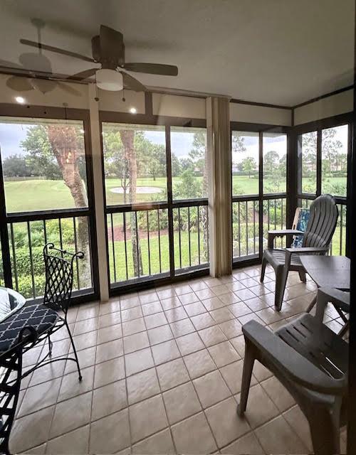 A screened-in porch with tile flooring, a ceiling fan, and views of a golf course — 15814 Loch Maree Lane # 3305, Delray Beach FL 33446, DELRAY BEACH, FL