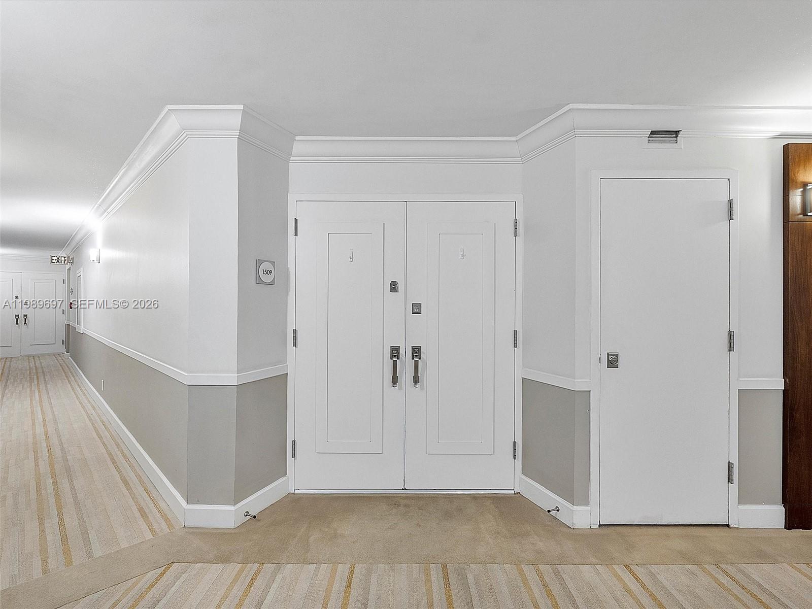 A hallway features a double door marked 1509 next to a single white door — 550 S Ocean Blvd # 1509, Boca Raton FL 33432, BOCA RATON, FL