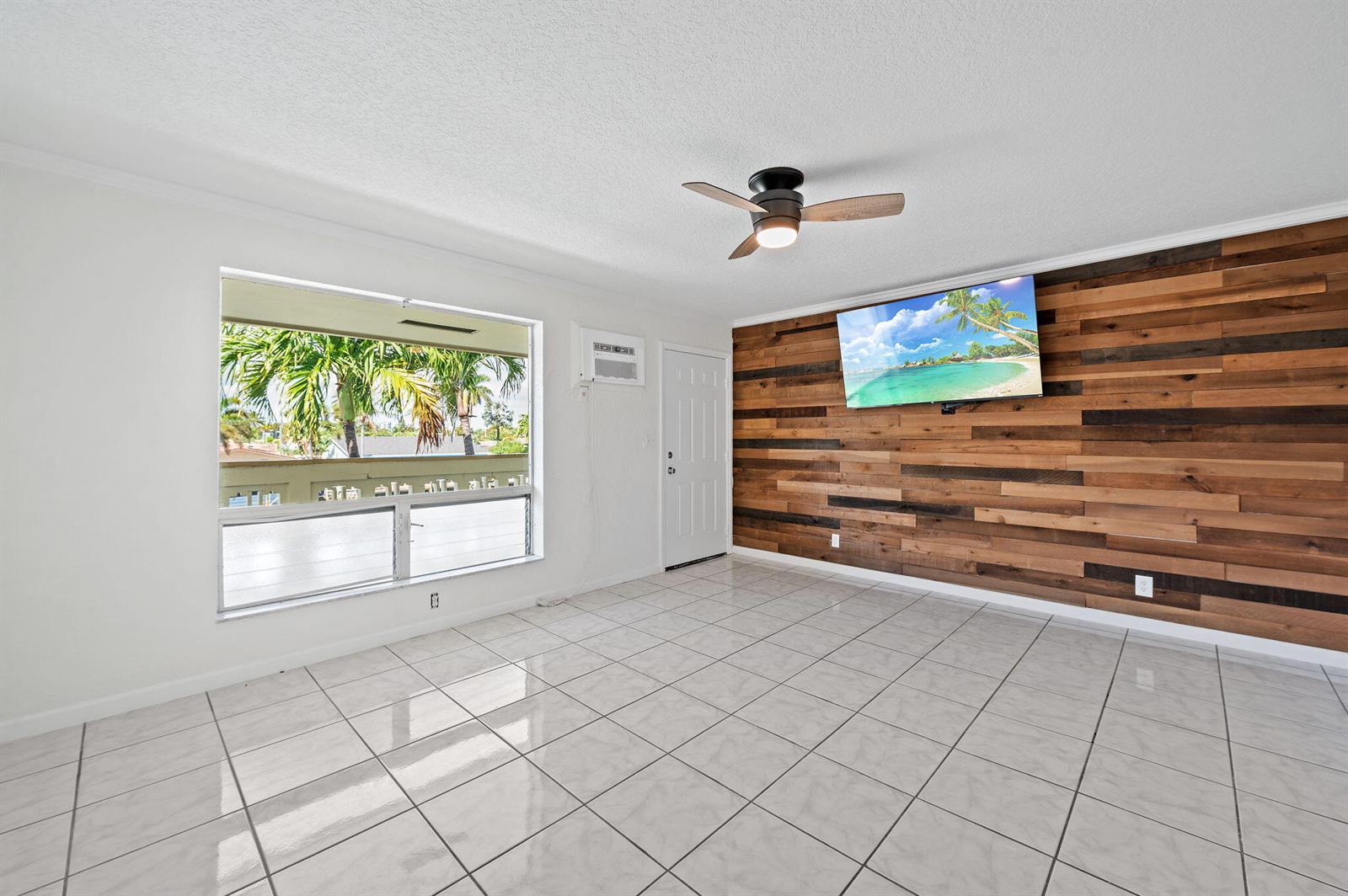 Aerial view of a waterfront building with a dock featuring several moored boats — 1780 SE 4th Street, Pompano Beach FL 33060, POMPANO BEACH, FL