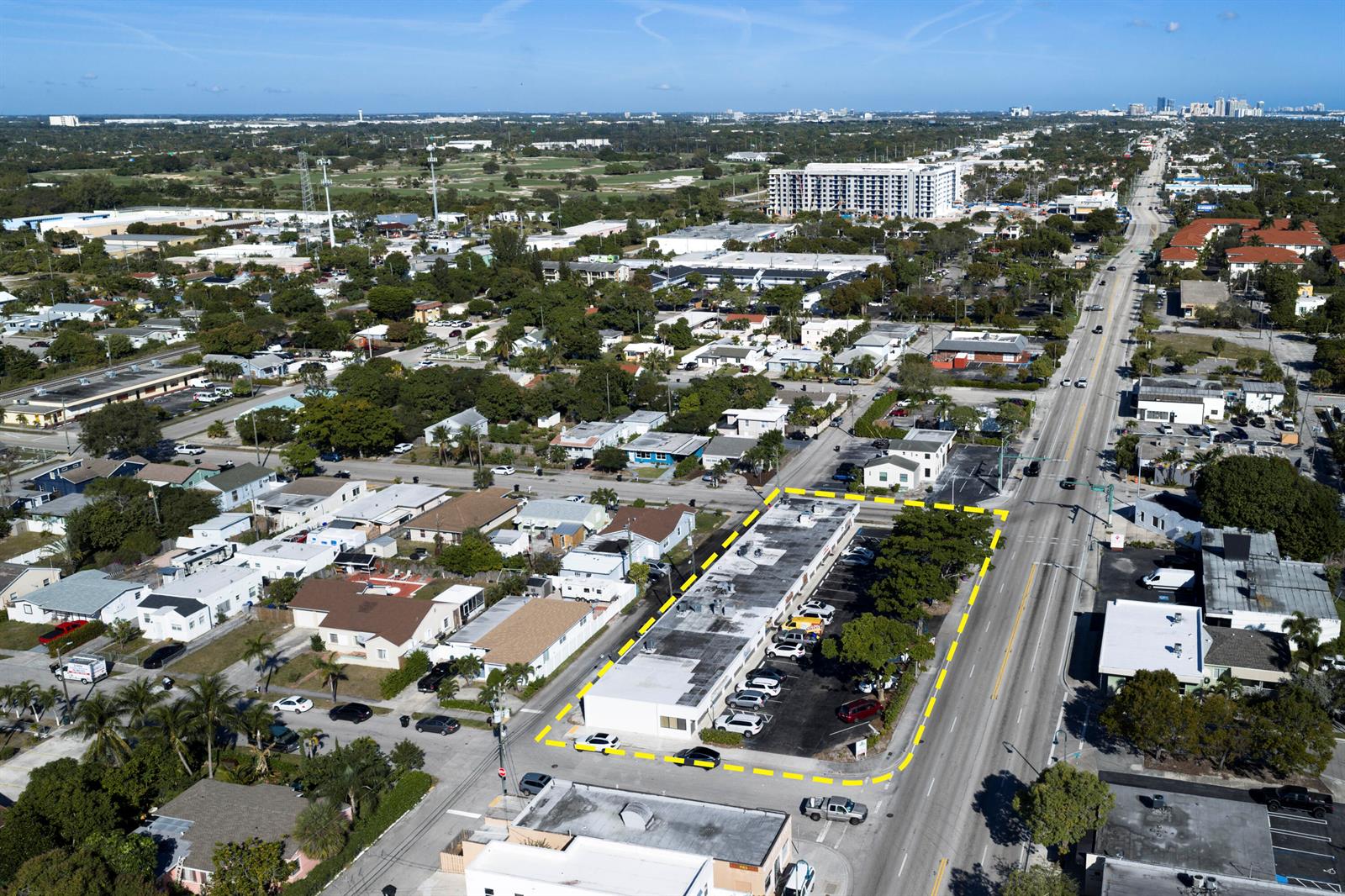 An aerial view shows a commercial building with a parking lot outlined in yellow — 2101 N Dixie Highway # 2101, FL 33460, FL