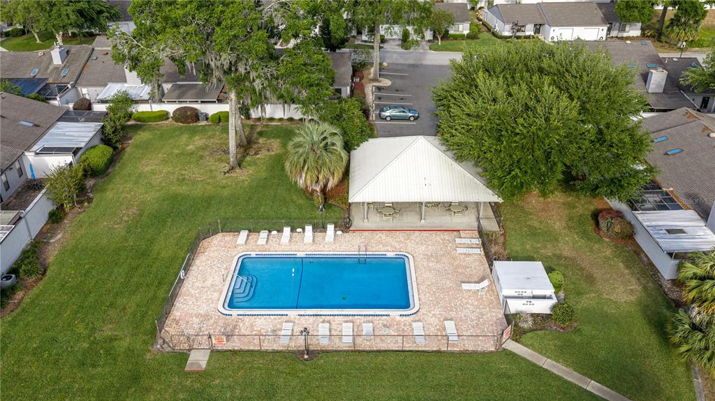 An aerial view of a rectangular swimming pool with a patio and covered pavilion — 2050 SE 37TH COURT CIRCLE, OCALA, FL