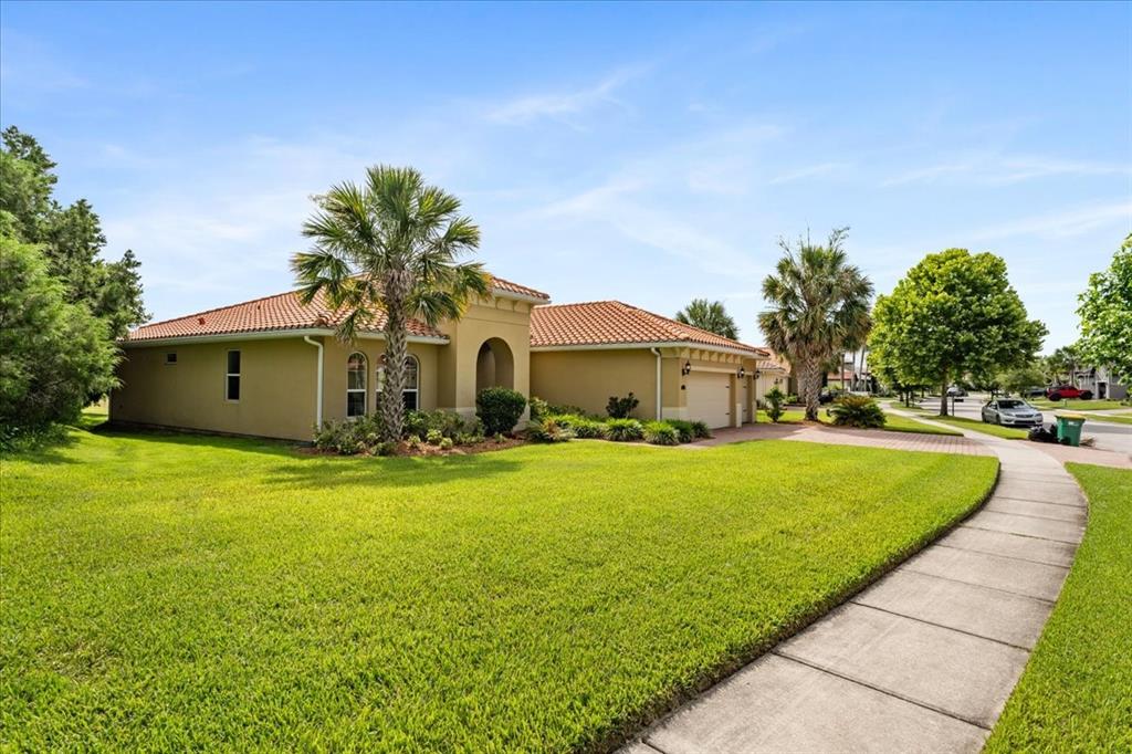 A single-story house with a tan stucco exterior and a red tile roof — 3801 BOWFIN TRAIL, KISSIMMEE, FL