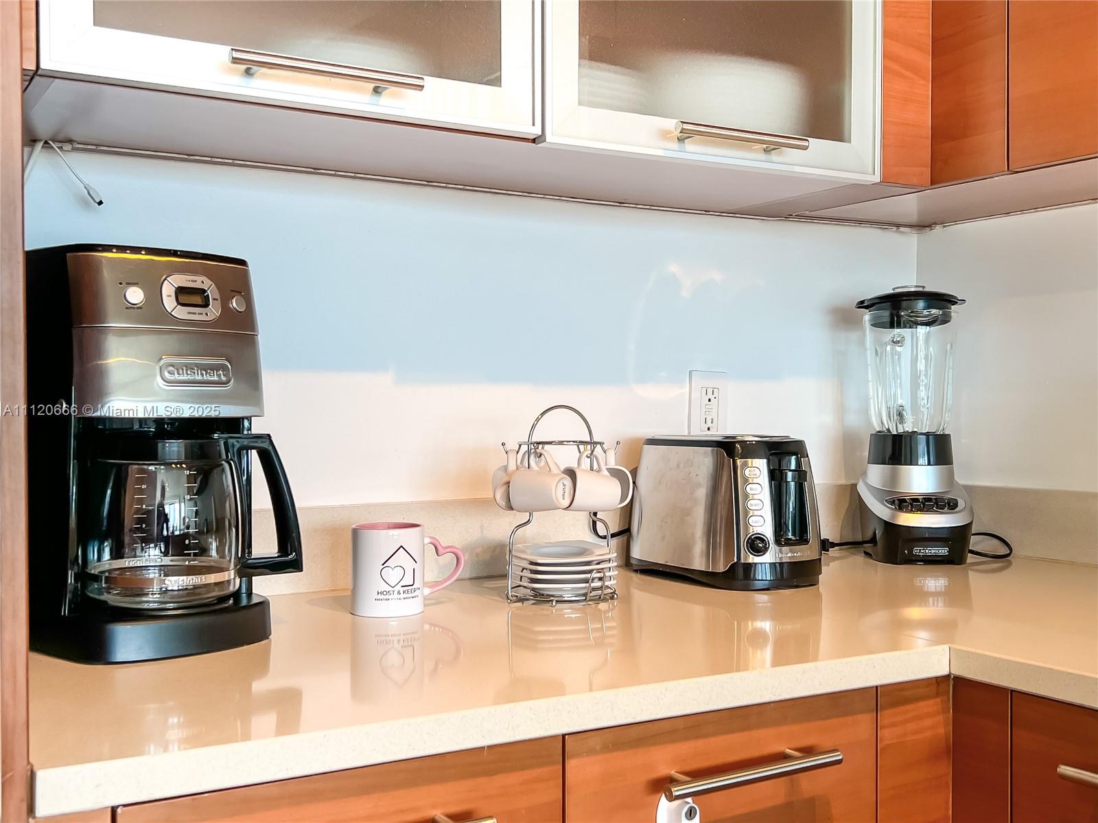 A kitchen counter features a coffee maker, a mug, a toaster, and a blender — 3250 NE 1st Ave # 708, Miami FL 33137, MIAMI, FL