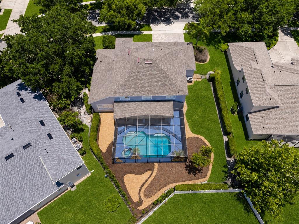 An aerial view shows a house with a screened-in pool and a landscaped backyard — 2106 STILLINGTON STREET, ORLANDO, FL