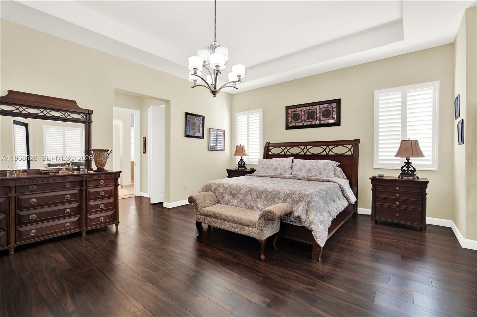 A spacious foyer features a curved balcony, two white columns, and tile flooring — 7823 SW 195th Ter, Cutler Bay FL 33157, CUTLER BAY, FL