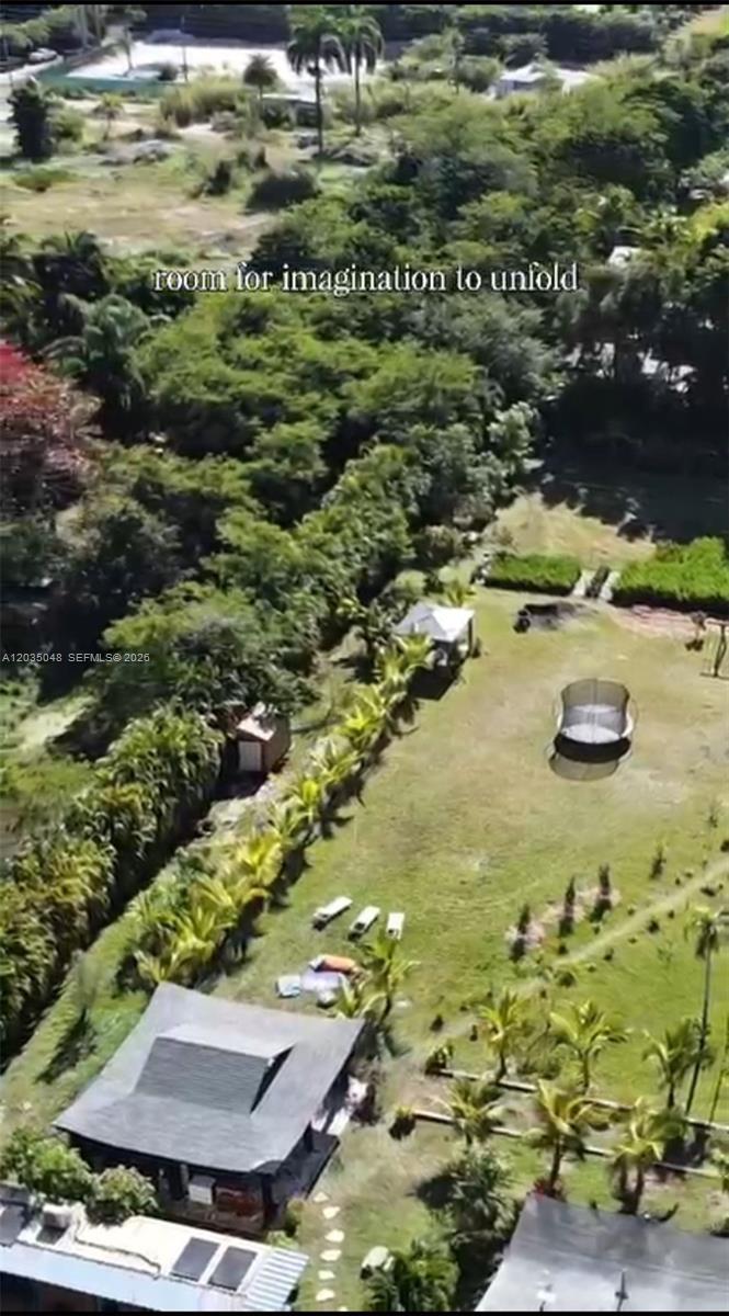 An aerial view shows a house with a large backyard, a trampoline, and dense vegetation — 6560 SW 189th Way, Southwest Ranches FL 33332, SOUTHWEST RANCHES, FL