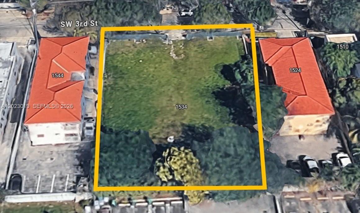 An aerial view shows a vacant rectangular lot situated between two buildings with red roofs — 1534 SW 3rd St, Miami FL 33135, MIAMI, FL