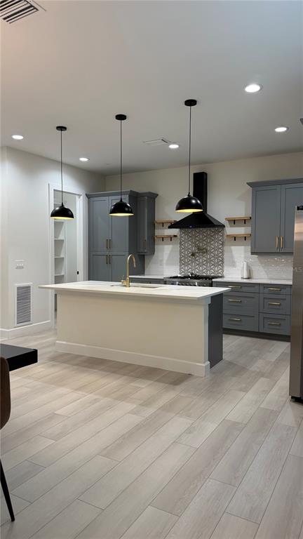 An entryway features a blue front door, white walls, light flooring, and a staircase — 4917 N NEBRASKA AVENUE, TAMPA, FL