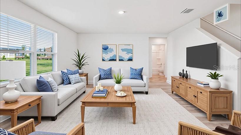 This is a digital rendering of a modern living room with light wood furniture — 5205 SW 40TH CIRCLE, OCALA, FL