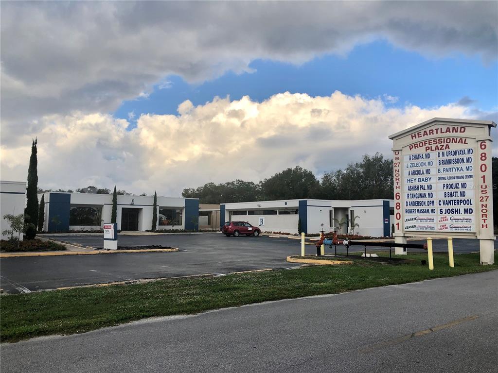 The exterior of a single-story commercial office complex with a large directory sign — 6801 US 27 HIGHWAY N UNIT C4, SEBRING, FL