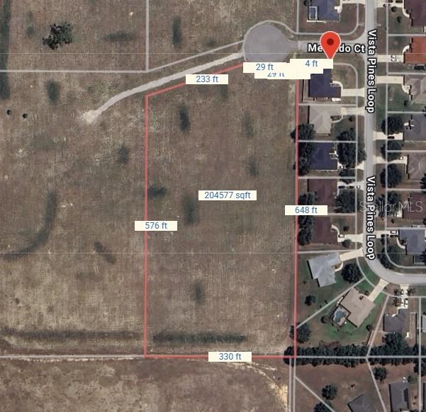 This is an aerial map showing a large, rectangular plot of land with boundary dimensions — LOT 3 MERCADO COURT, CLERMONT, FL