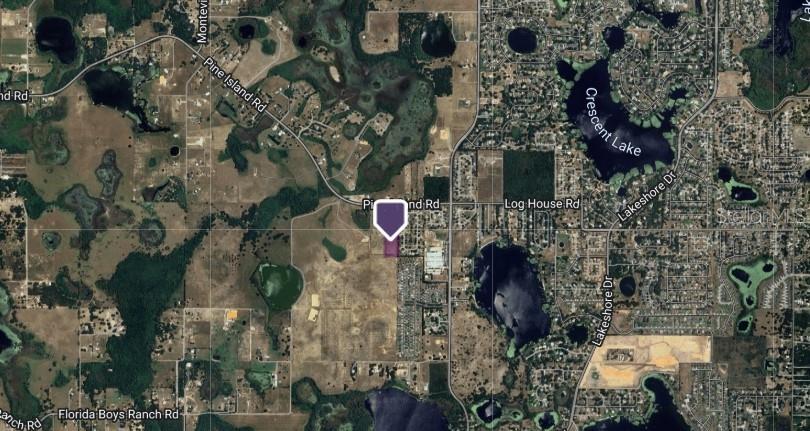 This is an aerial map showing a property location marked with a purple pin — LOT 3 MERCADO COURT, CLERMONT, FL