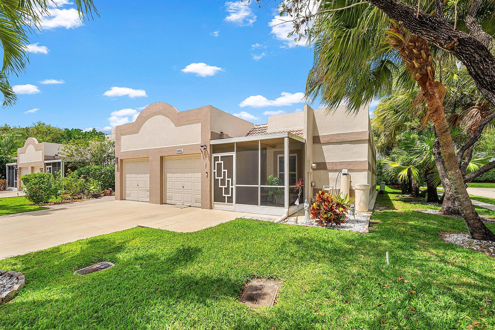 A beige single-story house with a two-car garage and a screened-in front porch — 18881 Jolson Avenue # 1, Boca Raton FL 33496, BOCA RATON, FL