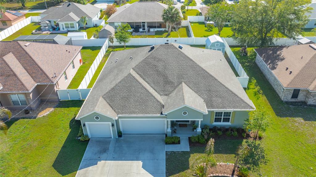 An aerial view of a single-story suburban house with a gray roof and driveway — 17 WHITE HAVEN LANE, PALM COAST, FL
