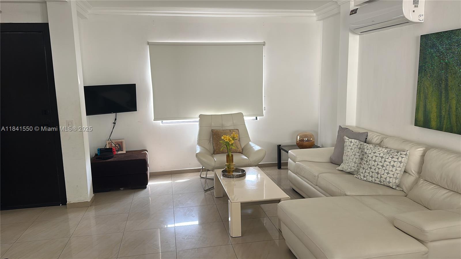 A living room features a white sofa, an armchair, a coffee table, and tiled floors — La Serena Mzna 4 Villa 11 Calle 3era, G, G
