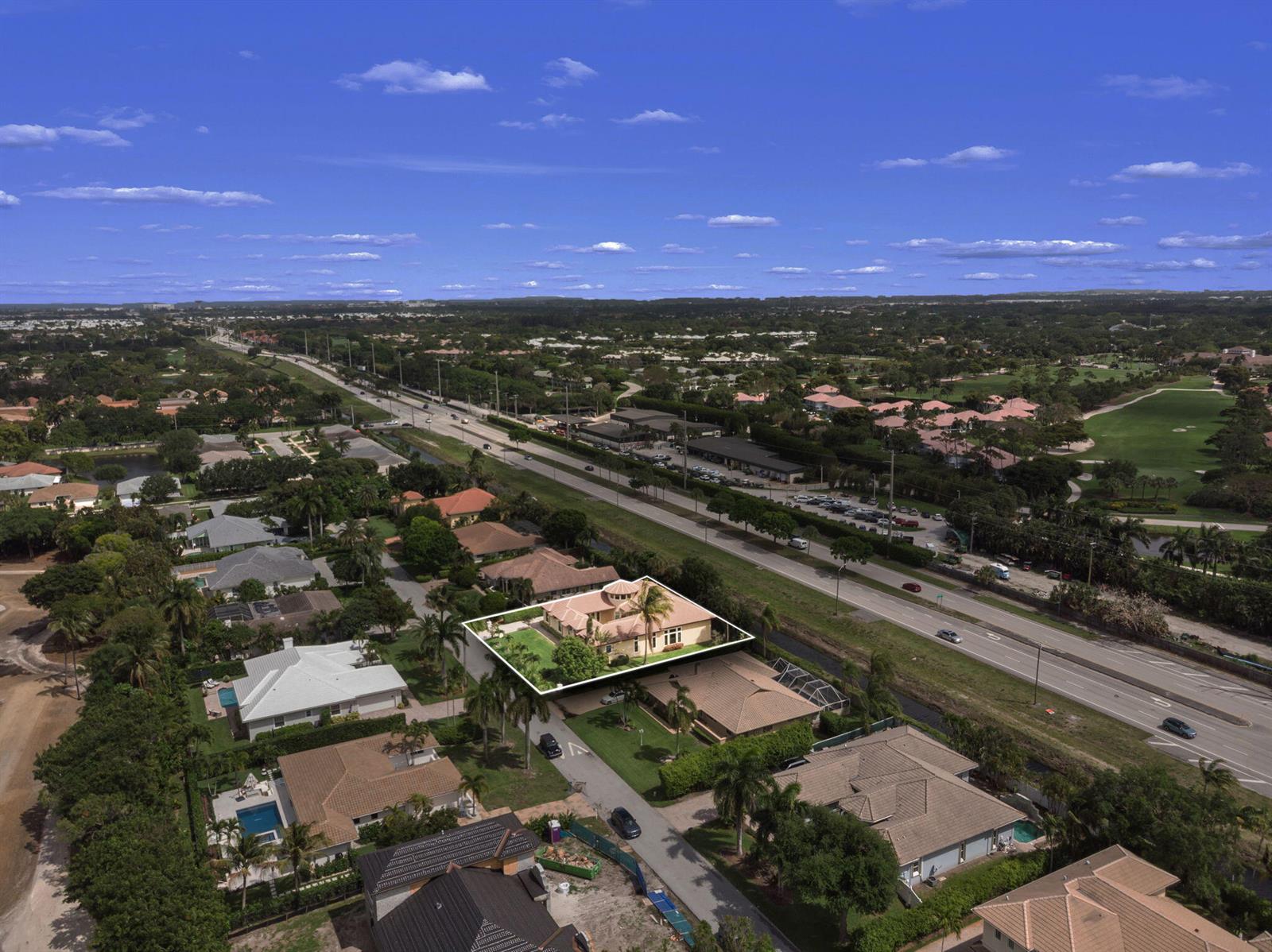 An aerial view shows a single-story house with a tan roof and a circular cupola — 4190 Gleneagles Drive, Boynton Beach FL 33436, BOYNTON BEACH, FL