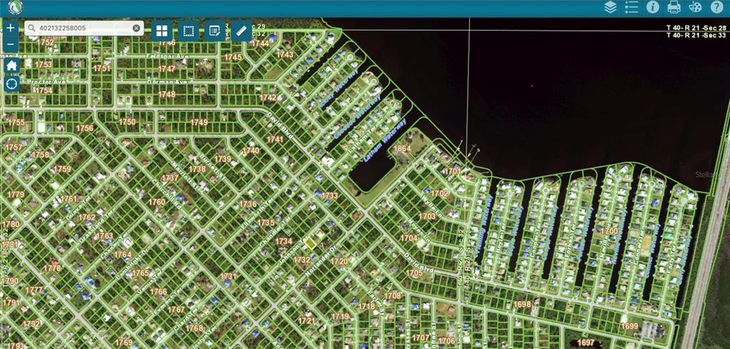 This is a satellite map showing a residential neighborhood with canal-front properties and street layouts — 5258 JOHNSON TERRACE, PORT CHARLOTTE, FL