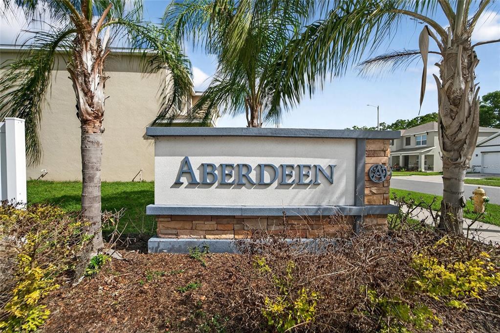 A stone and stucco monument sign for the Aberdeen community stands between two palm trees — 3009 BLAKERT COURT, PLANT CITY, FL