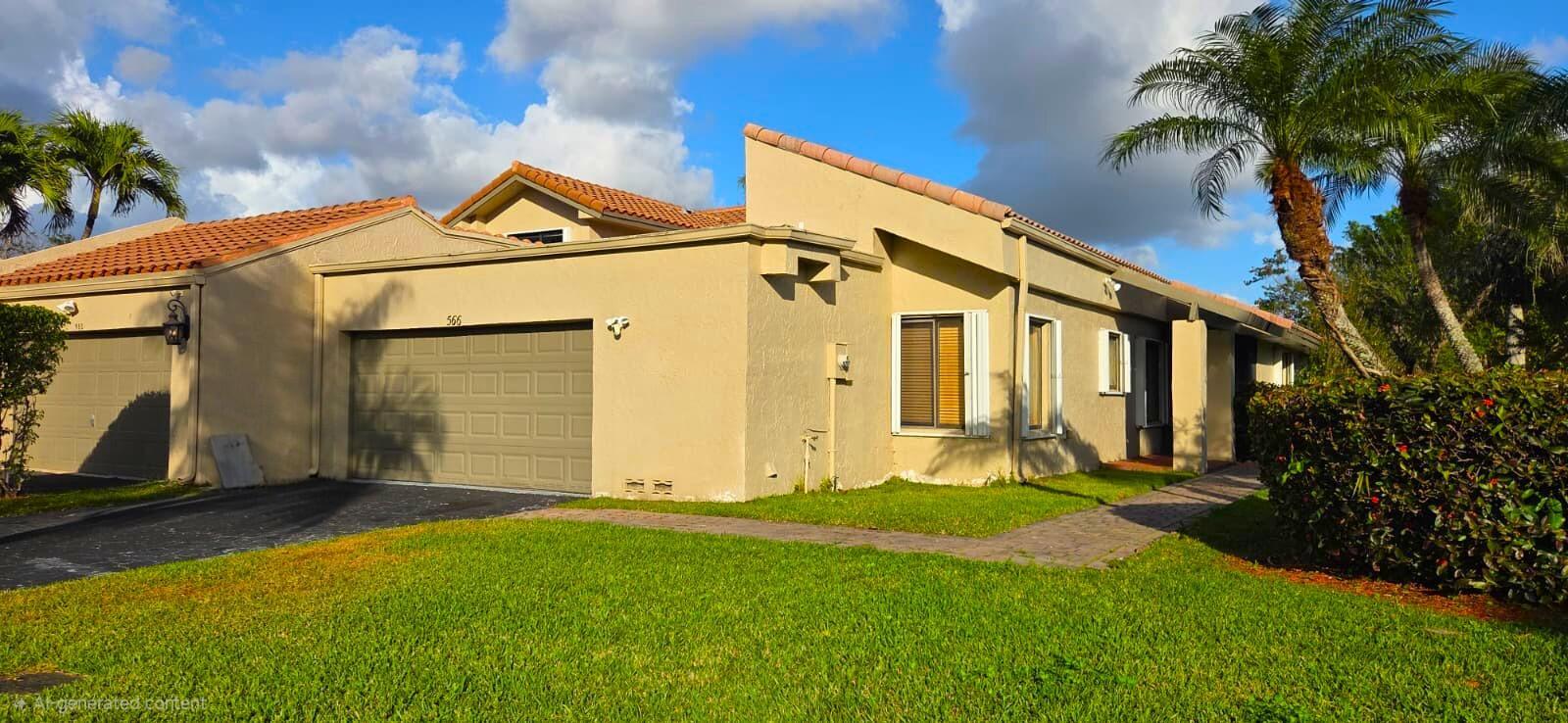 A tan single-story house with a two-car garage, tile roof, and a paved walkway — 566 Village Lake Drive, Weston FL 33326, WESTON, FL