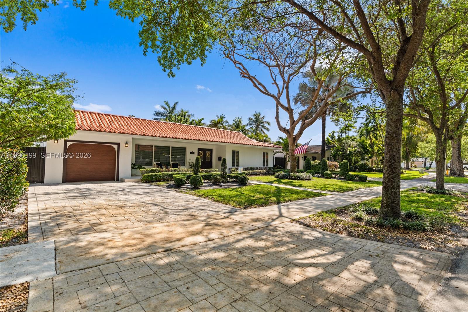 An aerial view shows a house with a red tile roof and a swimming pool — 7327 Sabal Dr, Miami Lakes FL 33014, MIAMI LAKES, FL
