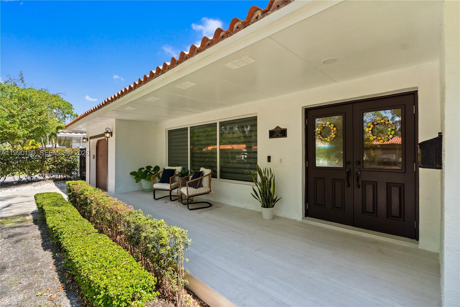 A single-story house with a white exterior, a red tile roof, and a front lawn — 7327 Sabal Dr, Miami Lakes FL 33014, MIAMI LAKES, FL