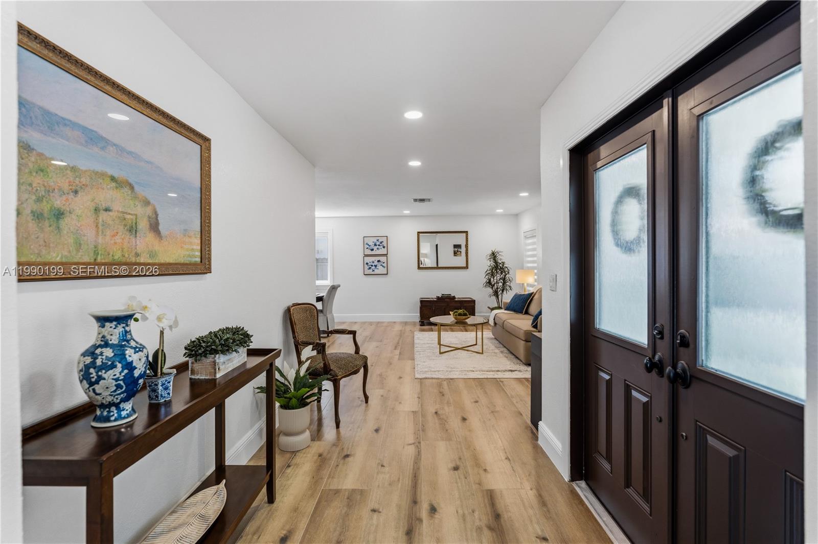 A single-story house with a tiled roof, a paved driveway, and mature trees — 7327 Sabal Dr, Miami Lakes FL 33014, MIAMI LAKES, FL