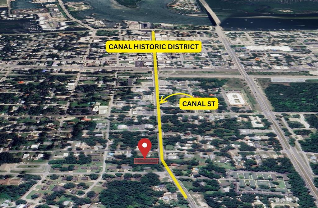 This is an aerial map showing a highlighted property lot near Canal Street — 907 CANAL STREET, NEW SMYRNA BEACH, FL