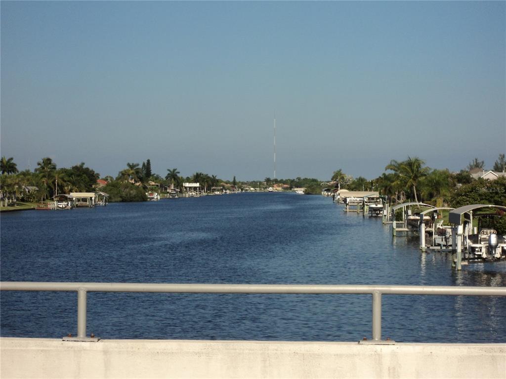 A view of a canal lined with boat docks and houses from a bridge — 13598 ALLAMANDA CIRCLE, PORT CHARLOTTE, FL